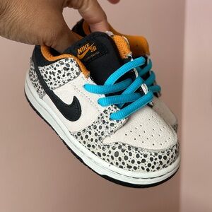 Nike Kids Sneakers - Black, White, and Blue with Orange Accents